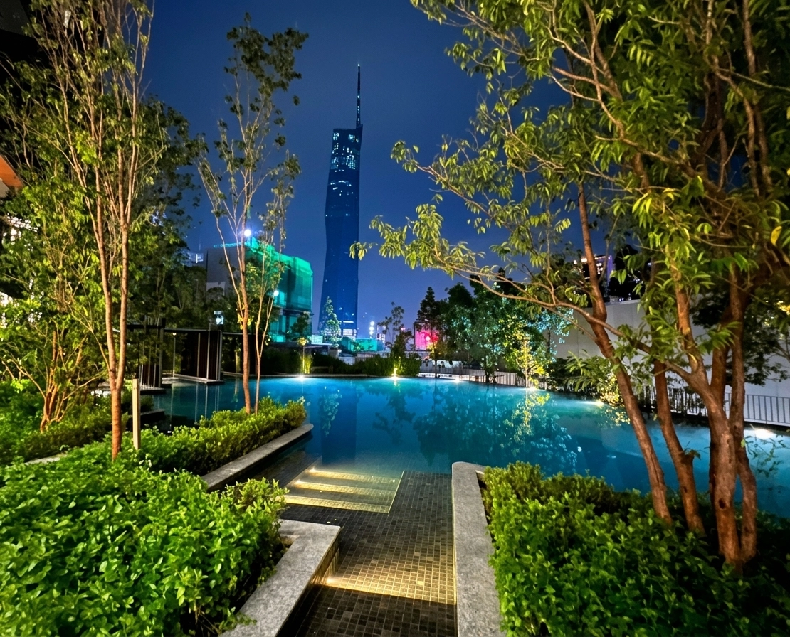 Rooftop infinity pool at night with Merdeka 118 view